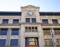 Clock on facade of old office building Royalty Free Stock Photo