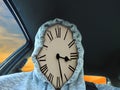 Clock face time piece wearing hoodie driving car late appointment