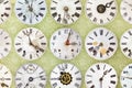 Clock faces in front of retro wallpaper Royalty Free Stock Photo