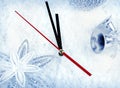 Clock with fir branches and Christmas decorations under snow close up Royalty Free Stock Photo