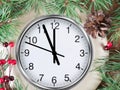 Clock on snow under decorated christmas tree Royalty Free Stock Photo