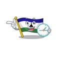 With clock flag lesotho hoisted on cartoon pole