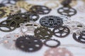 Clock gear wheels on table. Retro clock repairing abstract photo Royalty Free Stock Photo