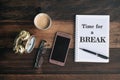 Clock, glasses, phone, coffee, mug and notebook with TIME FOR A BREAK word