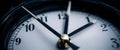 Clock hands rest just before midnight, emphasizing the urgency of deadlines and the fleeting nature of time. This Royalty Free Stock Photo
