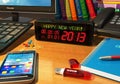 Clock with Happy New Year! message on table Royalty Free Stock Photo