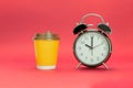 The clock indicates 10.00 and a disposable cup of coffee Royalty Free Stock Photo