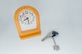 Clock and keys on a light background close-up Royalty Free Stock Photo
