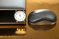 Clock and laptop with mouse. Time control for work and games online. Duration of work with a laptop