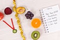 Clock made of fruits and vegetables and centimeter, new year resolutions of healthy lifestyles Royalty Free Stock Photo