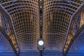 Clock and Skylight at Moynihan Train Hall of Penn Station at Night in New York City with Colorful Lights