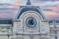 The clock of the Museum of Orsay in Paris at sunset Royalty Free Stock Photo