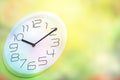 Clock and nature blurred abstract background. Royalty Free Stock Photo