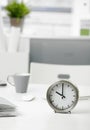 Clock on office desk Royalty Free Stock Photo