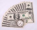 Clock over heap of money Royalty Free Stock Photo