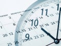 Clock overlay on calendar displaying date and time Royalty Free Stock Photo