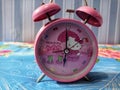 a clock that is pink is very beautiful