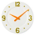 Clock from plate, carrots and green peas Royalty Free Stock Photo