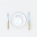 Clock in plate, Meal time concept.