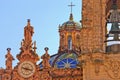 Clock on Santa Prisca church in Taxco, Mexico