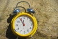 A clock shows five minutes to twelve. Royalty Free Stock Photo