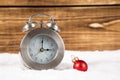 Clock with snow and christmas ball wintertime time change