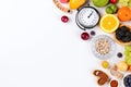 A clock surrounded by fruits and vegetables on a white background. Generative ai Royalty Free Stock Photo