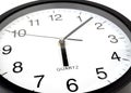 Clock or time abstract background, white clock and black needles, six o`clock, seven minutes Royalty Free Stock Photo