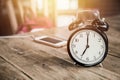 Clock times at 7 o`clock morning on wood table Royalty Free Stock Photo