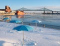 A Snowy Clock Tower Beach in Montreal with the Molson Brewery in