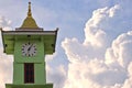 clock tower and big cloud Time concept of objects and nature Royalty Free Stock Photo