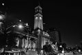 Clock tower building in city centre Brisbane on night, photo black and white