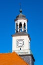 Clock tower of classicist Ratusz town hall palace at Rynek main market square in historic old town quarter of Trzebiatow in Poland