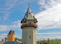 clock tower with clocks on each face side and weathervane on top