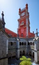 Clock tower and the cloisters of monastery in the Pena Palace. Sintra. Portugal Royalty Free Stock Photo