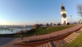 The clock tower on the fortress and the tree without leaves in autumn day in Serbia, city of Petrovaradin - Novi Sad. Royalty Free Stock Photo