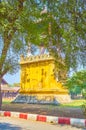 The clock tower among garden greenery in Mandalay Palace, Myanmar Royalty Free Stock Photo