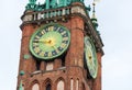 Clock tower of old historic brick town hall .