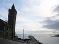 Clock tower and pier in the evening in the harbor of Porthleven Cornwall England Royalty Free Stock Photo