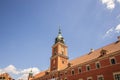 Clock tower of the royal castle in Warsaw in Poland against the blue sky on a summer warm day Royalty Free Stock Photo