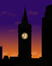 A clock tower is seen silhouetted at sunset Royalty Free Stock Photo
