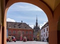 The Clock Tower in Sighisoara, seen through the arches at the entrance into the Citadel Square Royalty Free Stock Photo