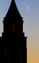 Clock Tower at Sunrise with Moon Royalty Free Stock Photo