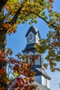 Clock Tower Surrounded by Fall Trees