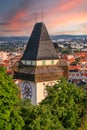 The Clock tower Uhrturm on Schlossberg hill in Graz, Austria overlooking the old town, popular travel destination Royalty Free Stock Photo