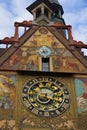 Clock tower of the Ulm Town Hall in Germany with heraldic symbols and murals on the wall Royalty Free Stock Photo