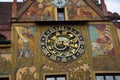 Clock tower of the Ulm Town Hall in Germany with heraldic symbols and murals on the wall Royalty Free Stock Photo