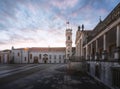 Clock Tower and University of Coimbra courtyard Paco das Escolas at sunset, former Royal Palace - Coimbra, Portugal Royalty Free Stock Photo