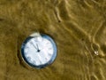 Clock under water. Royalty Free Stock Photo