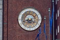 Clock on the wall of the city hall of Oslo, Norway. Royalty Free Stock Photo
